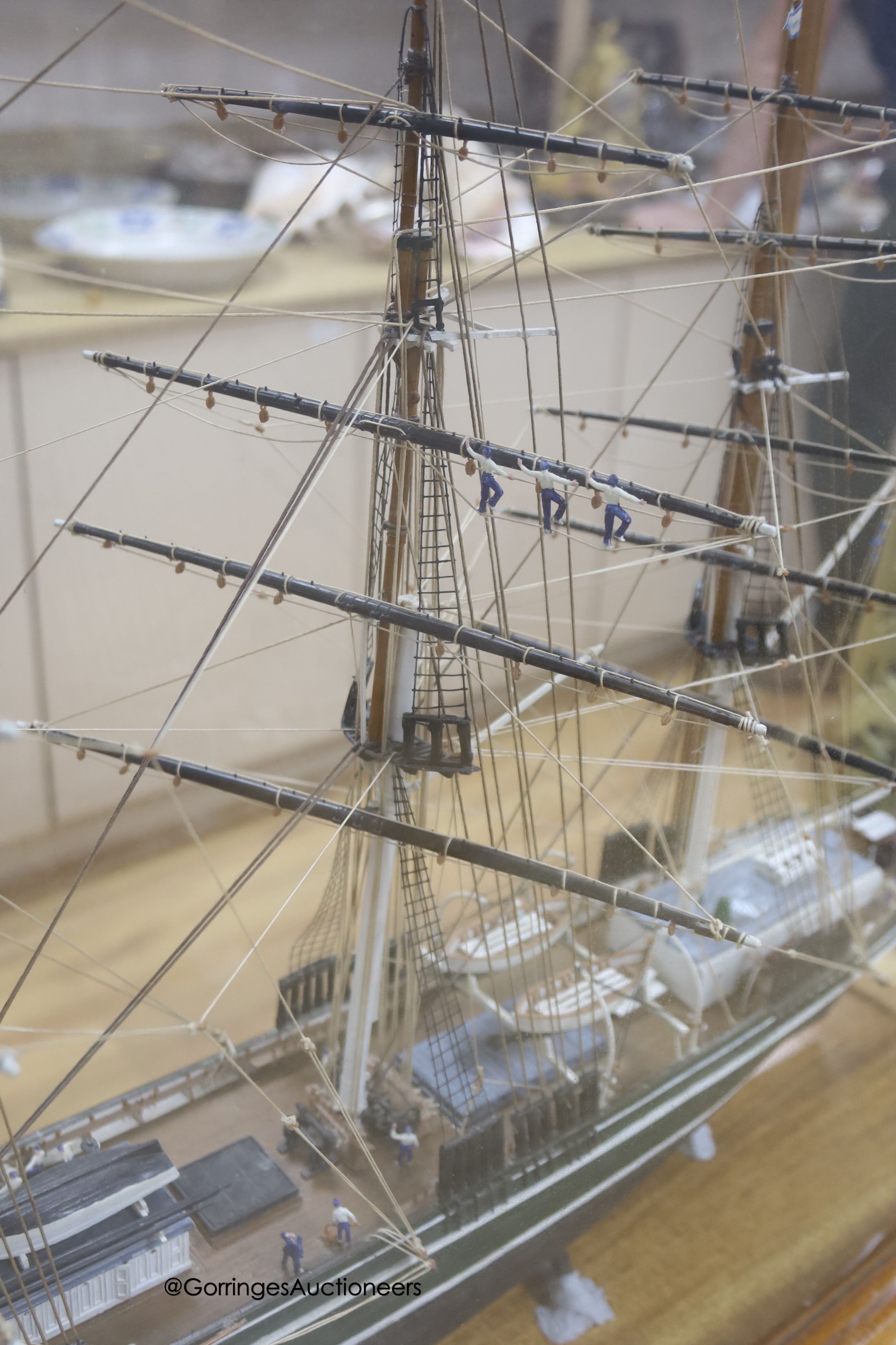 A model of a clipper ship in glazed case